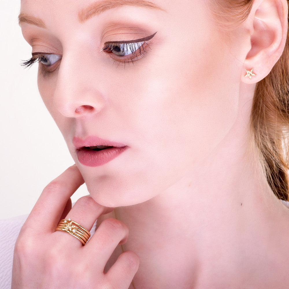 solid gold universe star stacking rings and star earrings