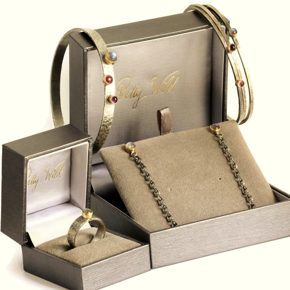 a selection of handmade blossom silver ad gold gemstone jewellery