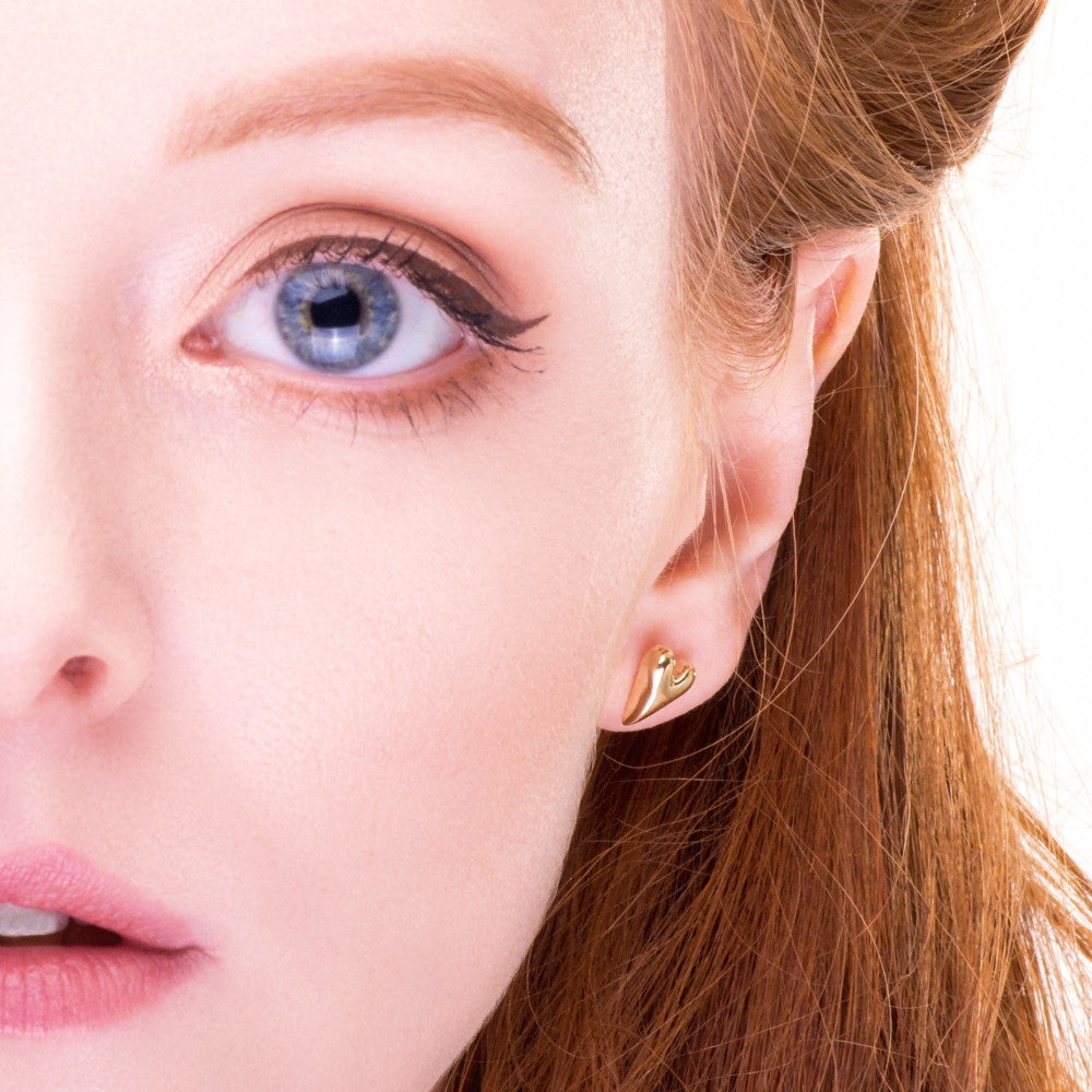 beautiful model wearing pretty wild at heart 9ct gold studs