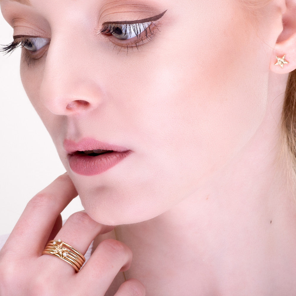 luxury gold universe diamond and textured star stacking rings 