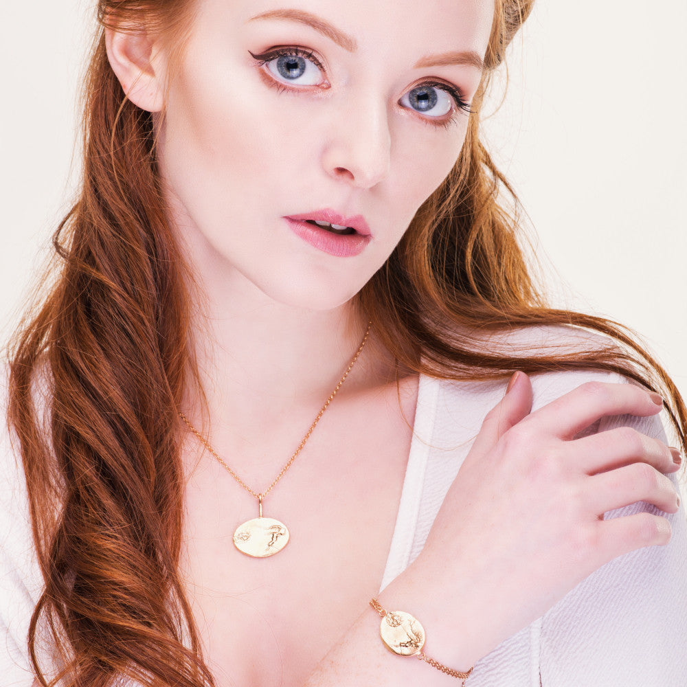 Designer fairy necklace contemporary in style featuring gold stars