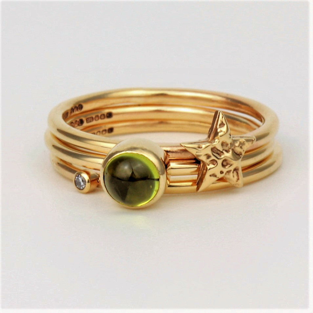 Universe gold stacking rings in Peridot gemstone