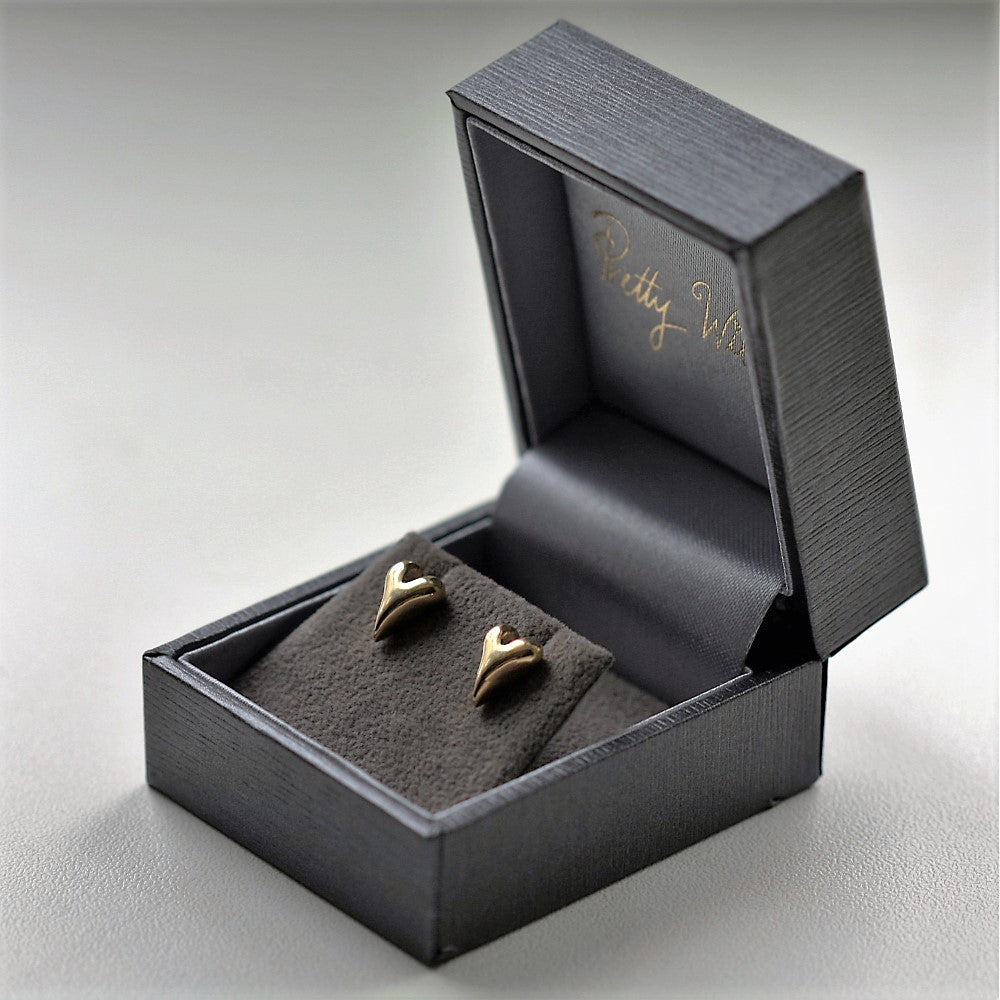 Gold heart shaped stud earrings